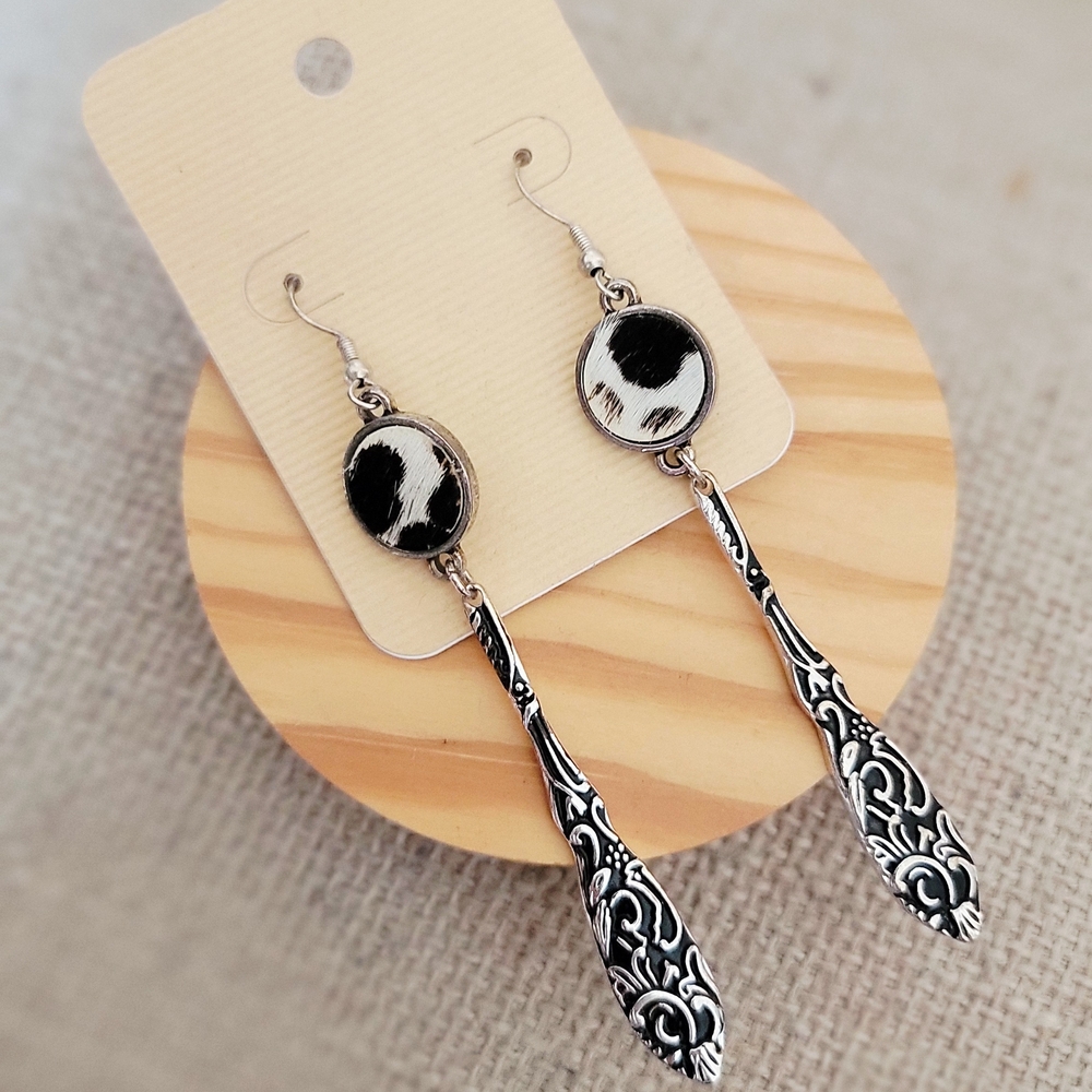 Black and White Cowhide Drop Earrings with Ornate Silver-Tone Detail